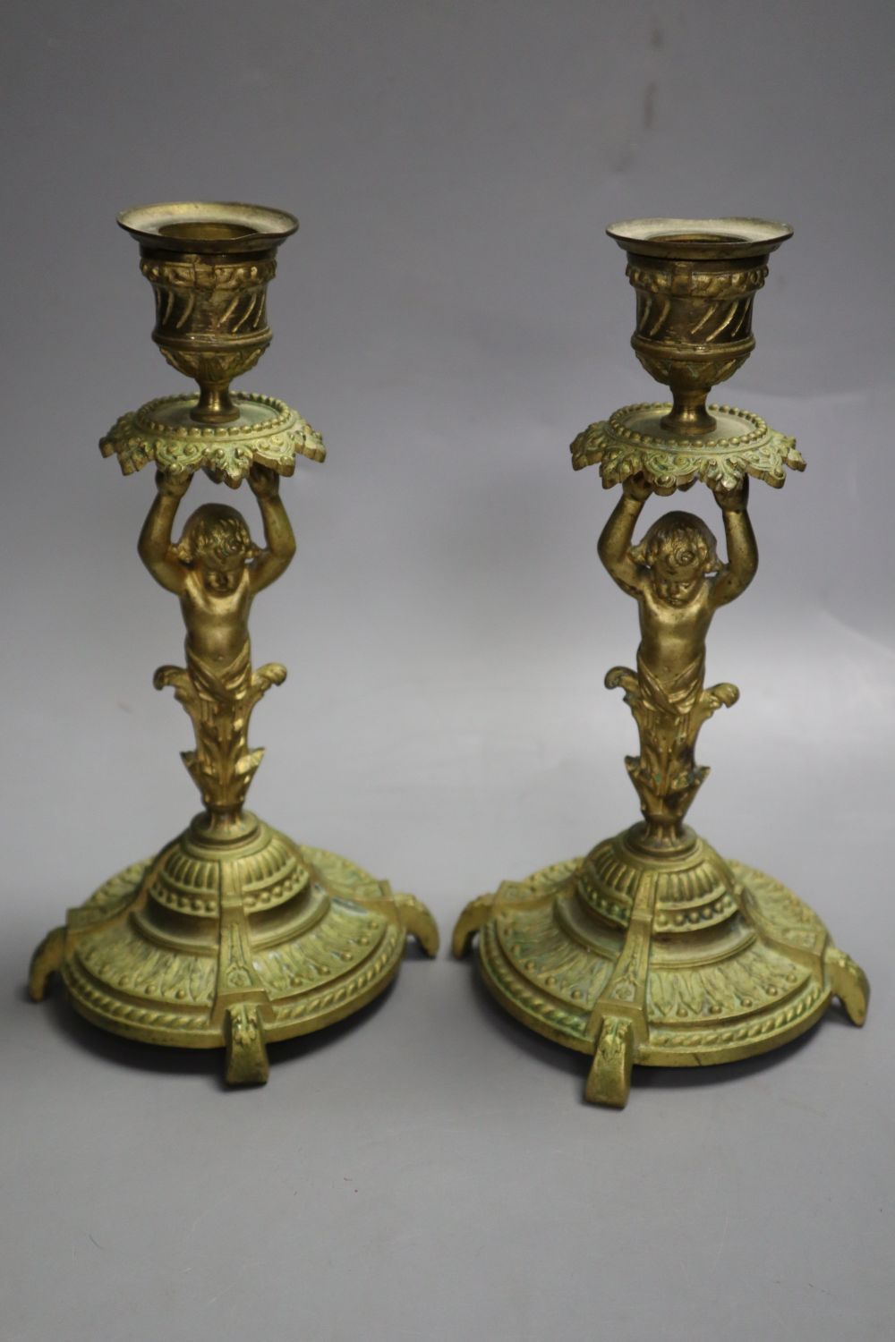A pair of ormolu figural candlesticks, 20cm